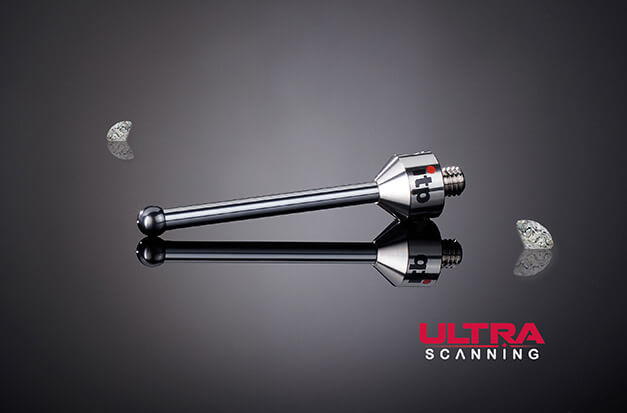 Short silver diamond stylus with a dark ball tip reflects on black glass. Loose diamonds flank an Ultra Scanning logo.
