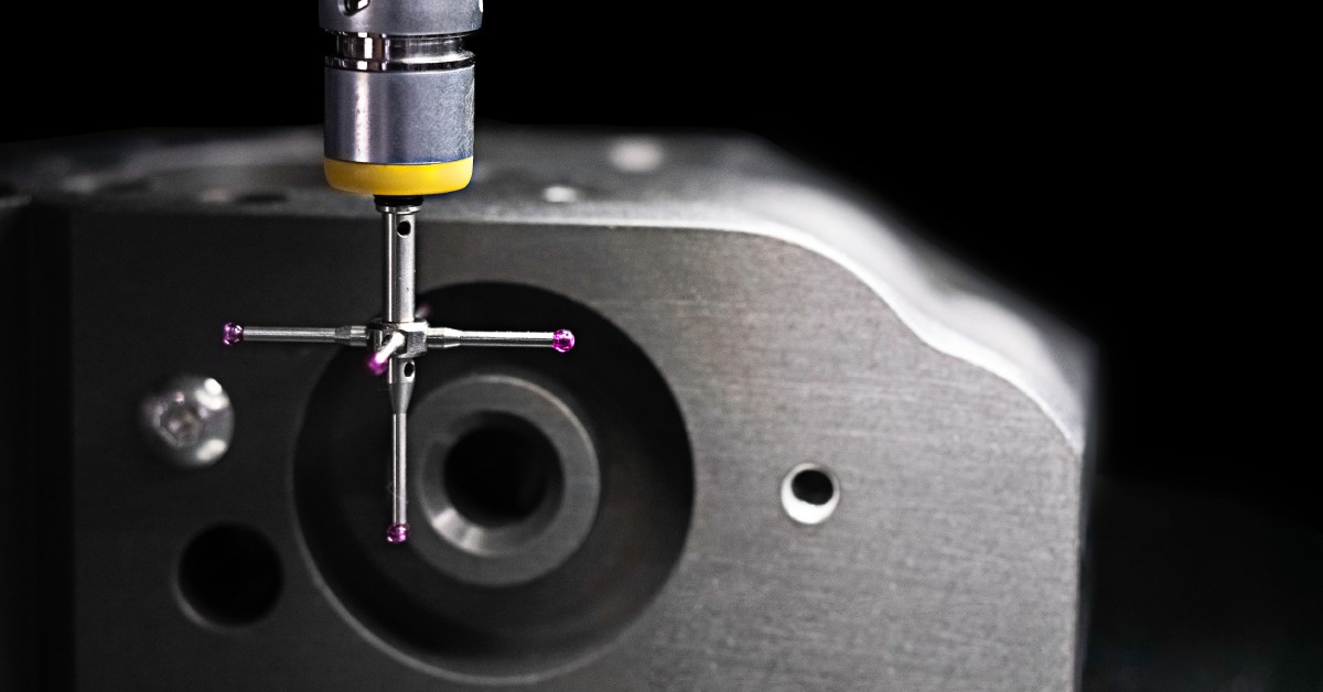 A CMM stylus with five separate points or tips. The stylus is attached to the machine and ready for use.